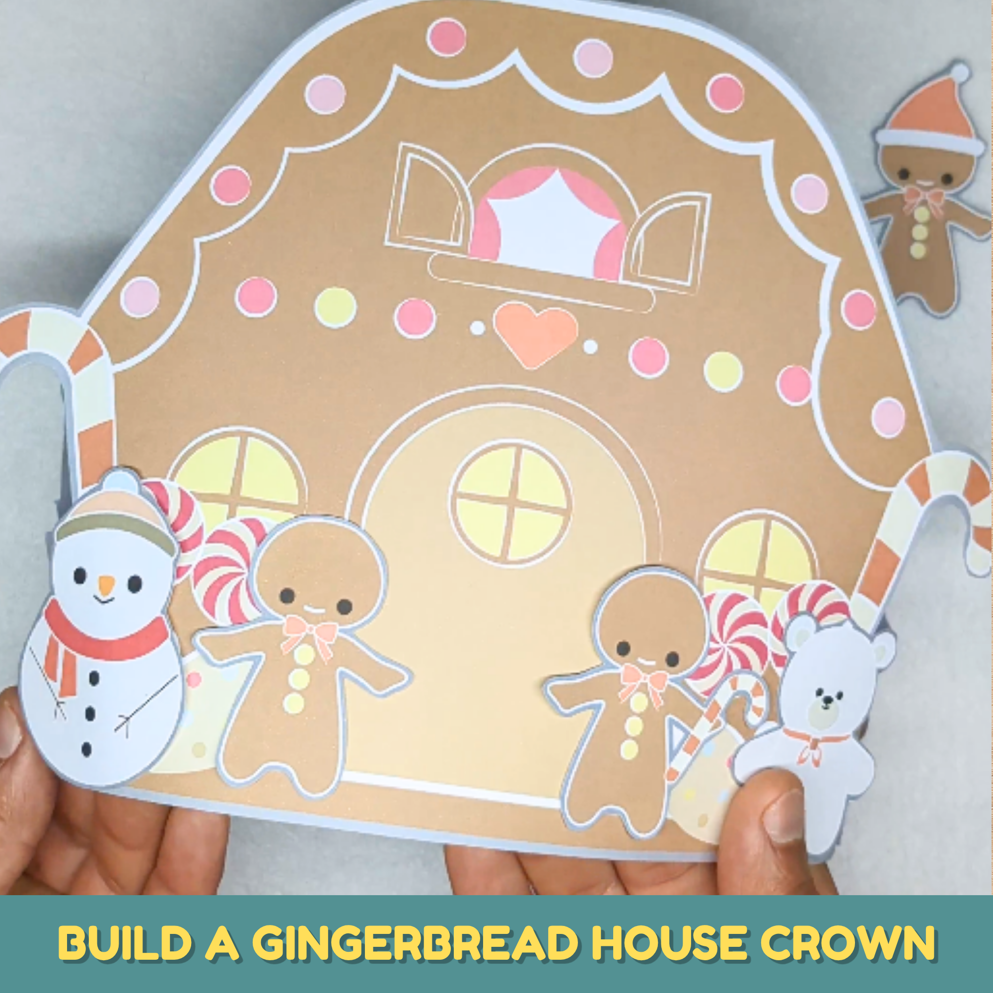 Child-made 3D printable gingerbread house craft with gingerbread people, a snowman, and a polar bear for the holidays.
